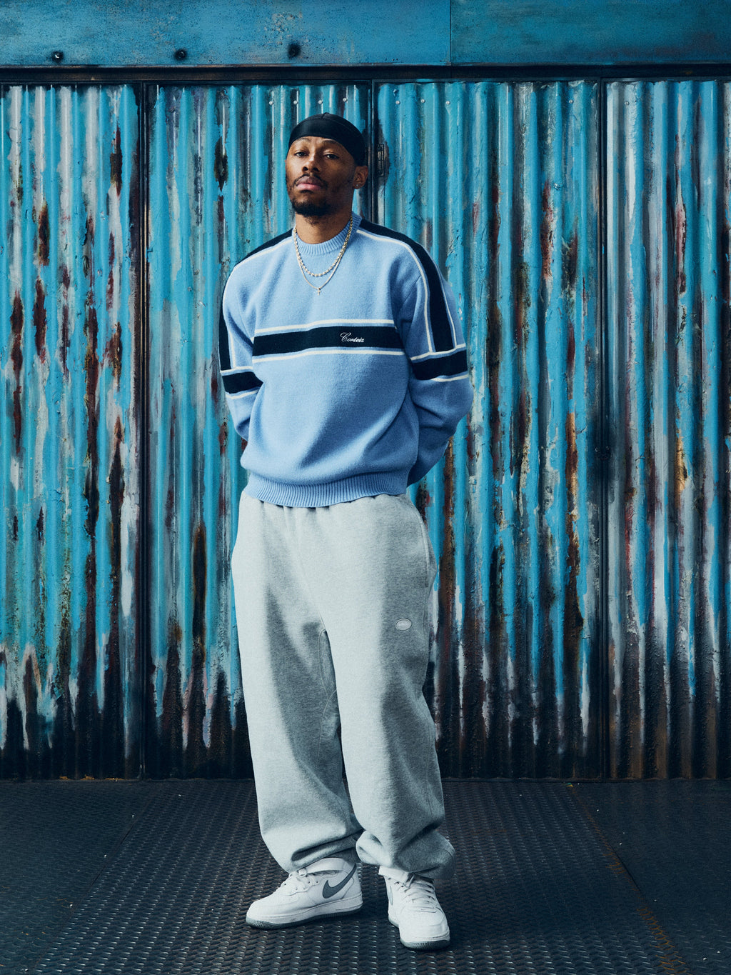 Corteiz Turismo Knit Sweater — Baby Blue — styled view