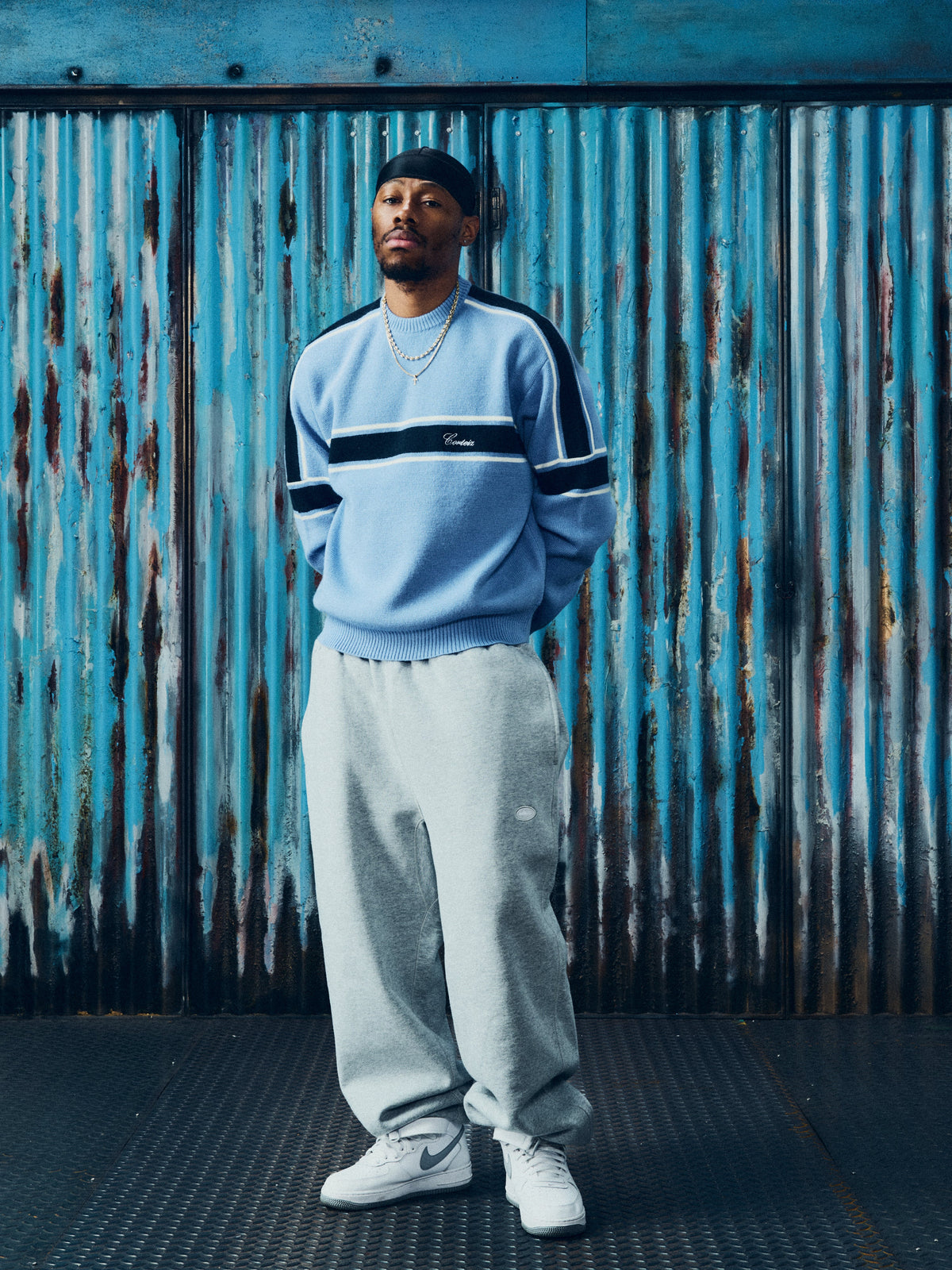 Corteiz Turismo Knit Sweater — Baby Blue — styled view