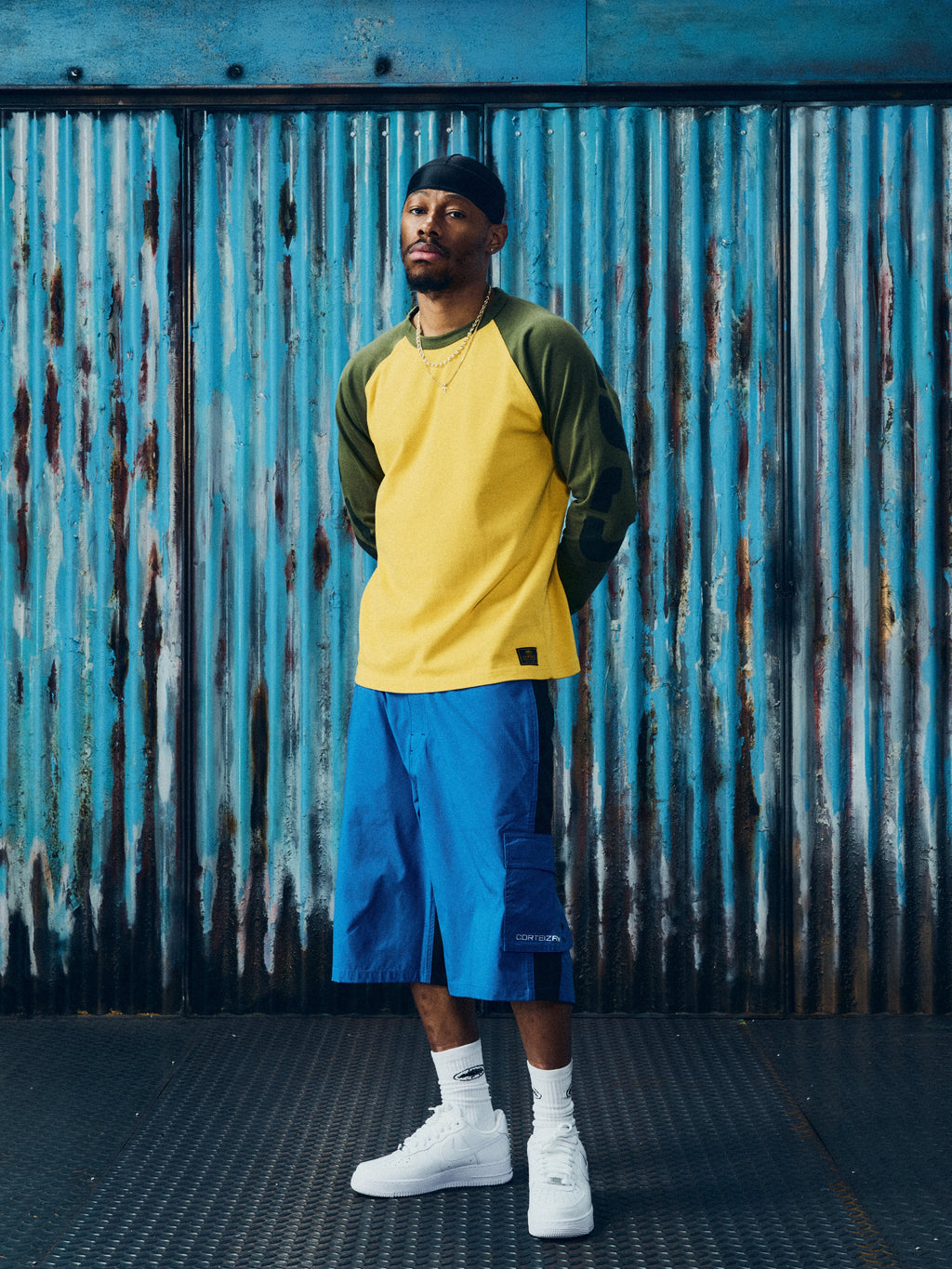 CORTEIZ Stencil Raglan Long Sleeve — Gold/Olive — styled view