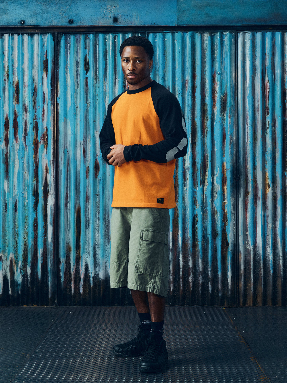 CORTEIZ Stencil Raglan Long Sleeve — Orange/Black — styled view