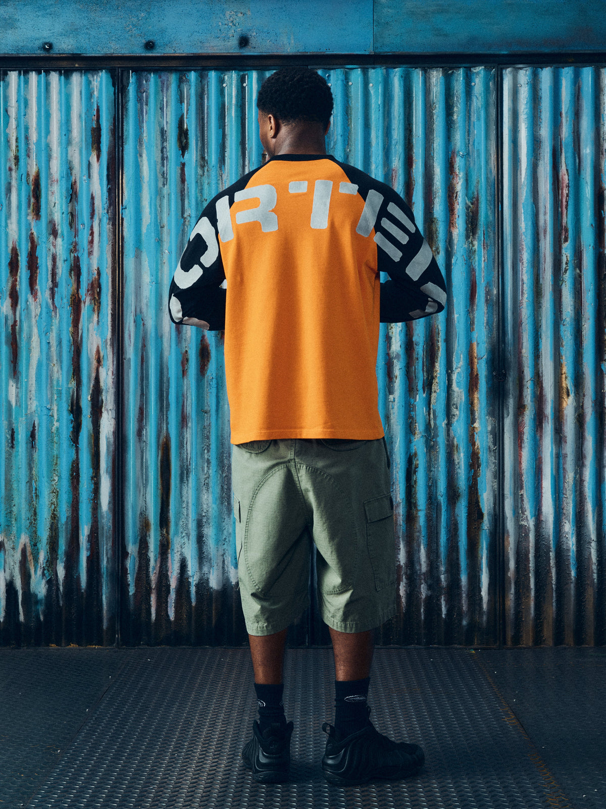 CORTEIZ Stencil Raglan Long Sleeve — Orange/Black — styled view