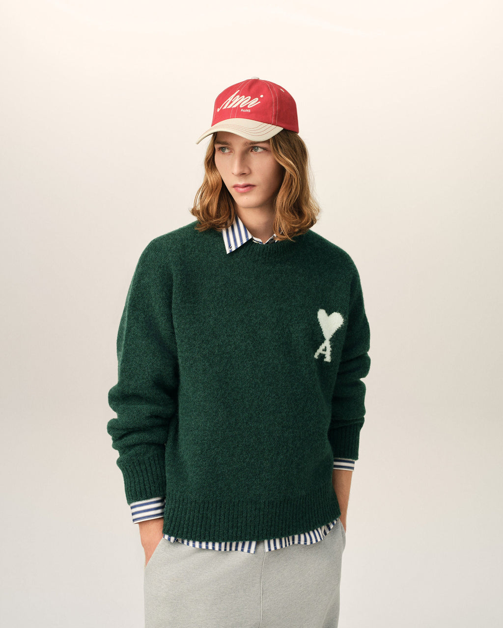 AMI Paris Ami de Cœur Textured Logo Crewneck Sweater — Forest Green / Ivory — styled front view
