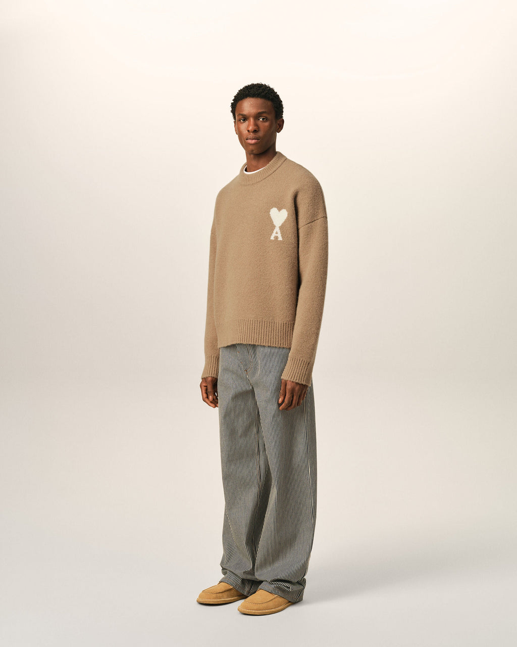 AMI Paris Ami de Cœur Textured Logo Crewneck Sweater — Camel / Ivory — styled side view