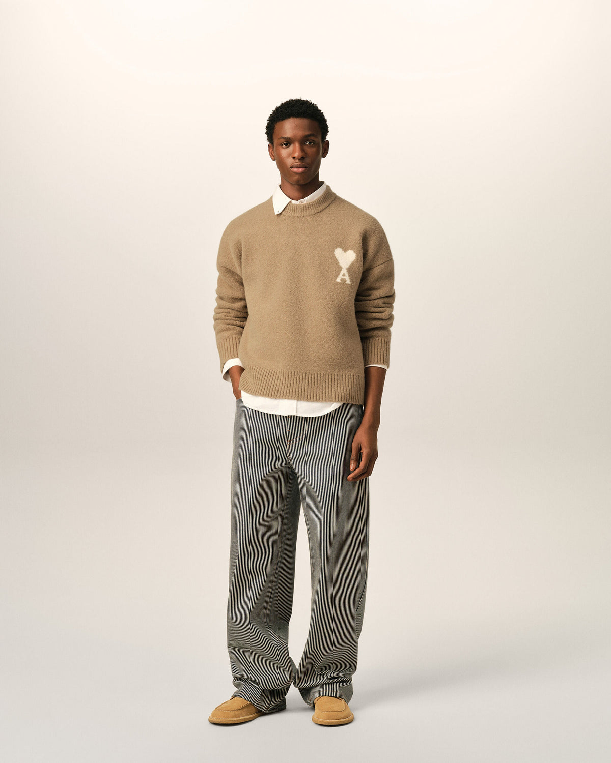 AMI Paris Ami de Cœur Textured Logo Crewneck Sweater — Camel / Ivory — styled front view