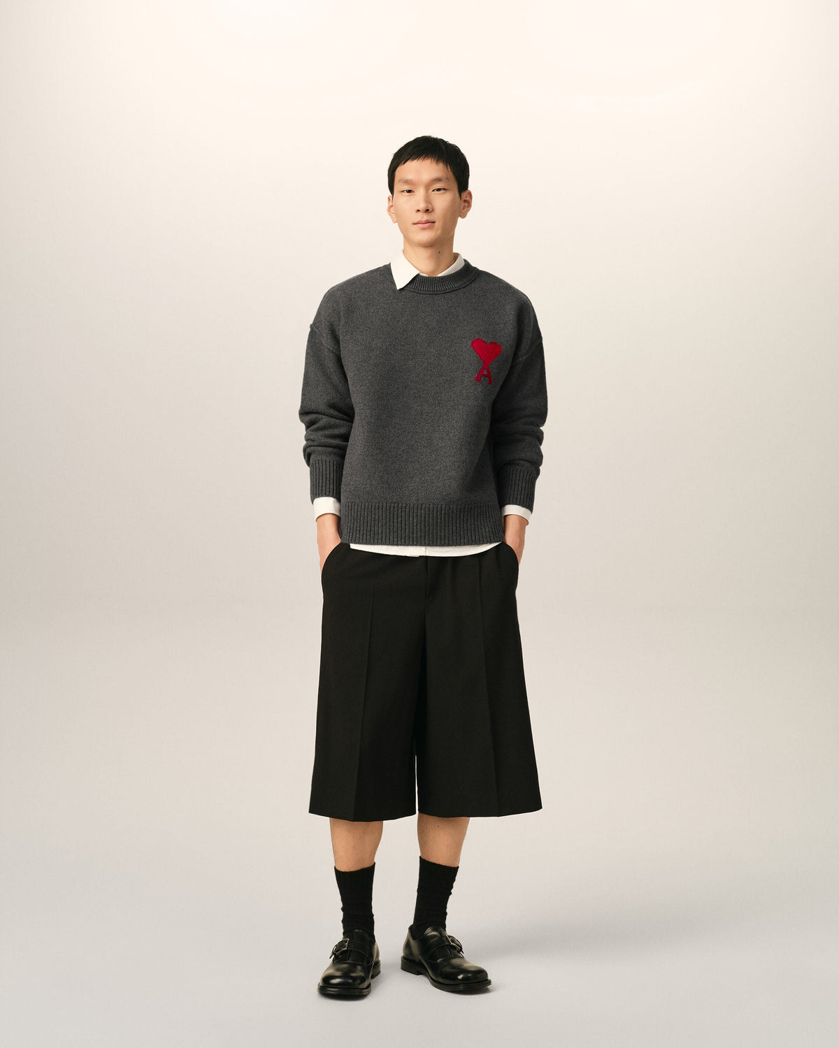 AMI Paris Ami de Cœur Large Logo Crewneck Sweater — Charcoal / Red — styled front view
