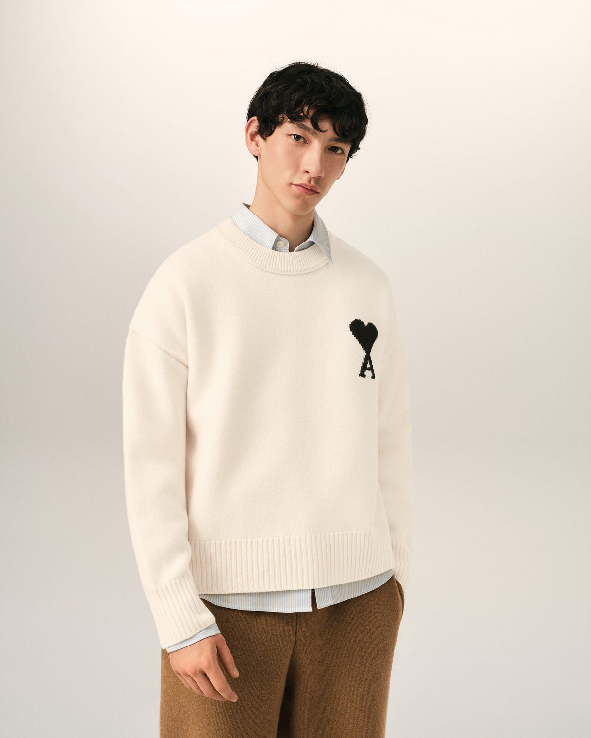 AMI Paris Ami de Cœur Large Logo Crewneck Sweater — Ivory / Black — styled front view
