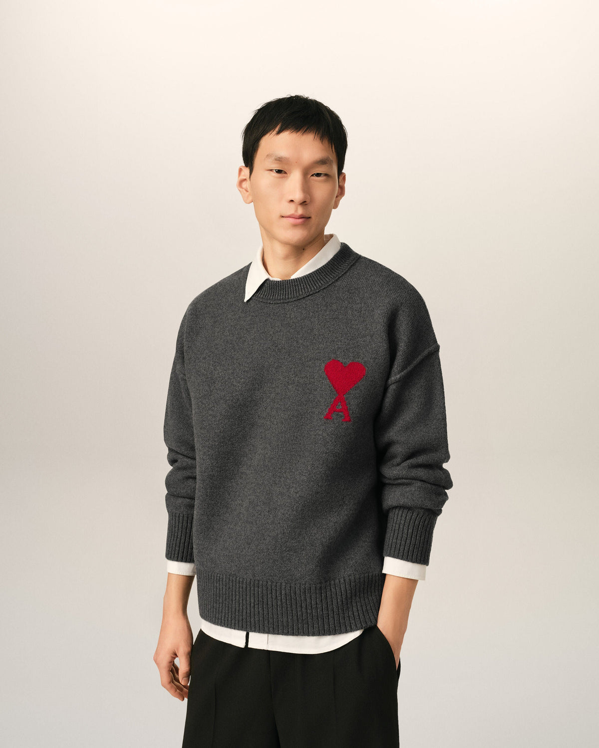 AMI Paris Ami de Cœur Large Logo Crewneck Sweater — Charcoal / Red — styled front view