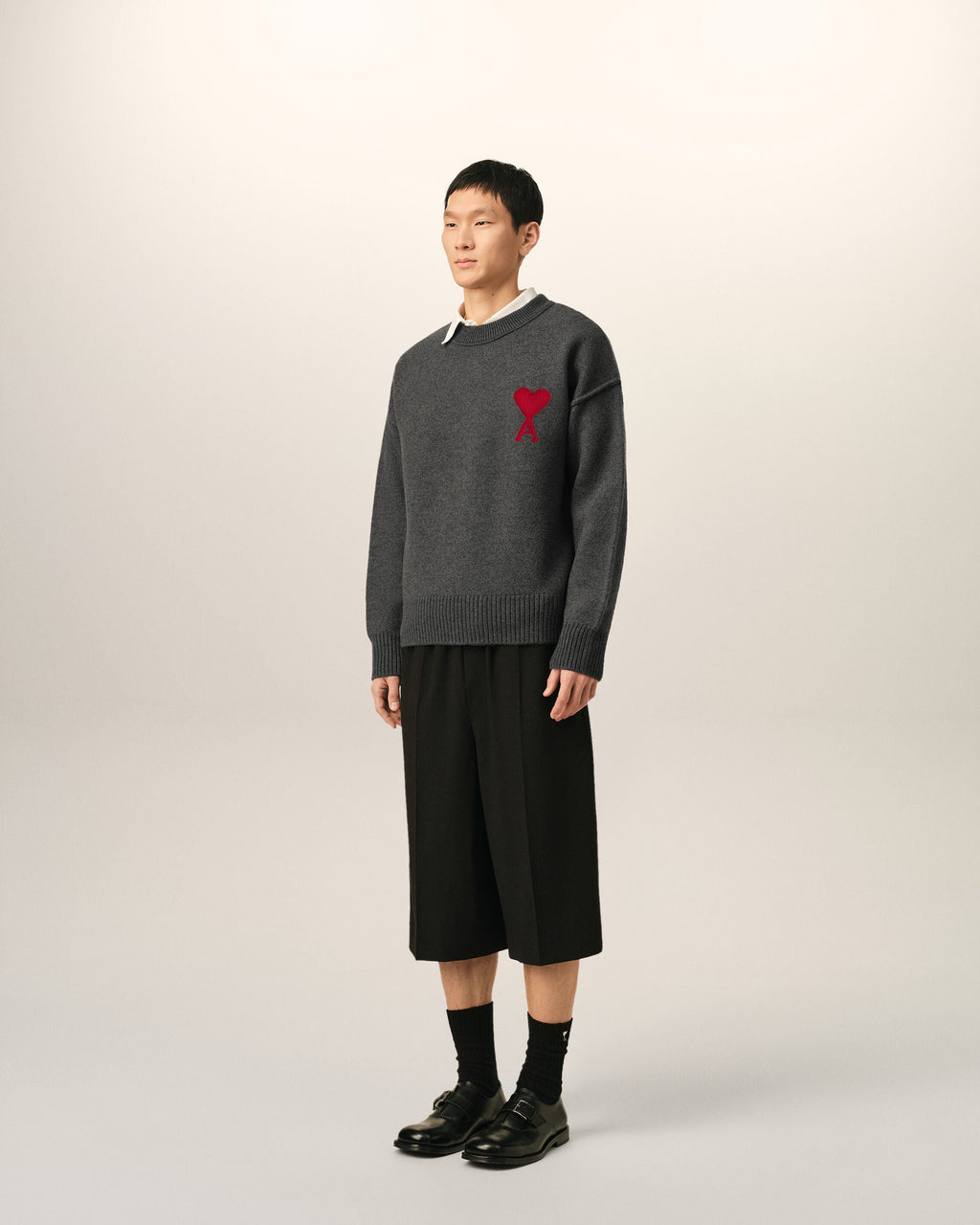AMI Paris Ami de Cœur Large Logo Crewneck Sweater — Charcoal / Red — styled side view