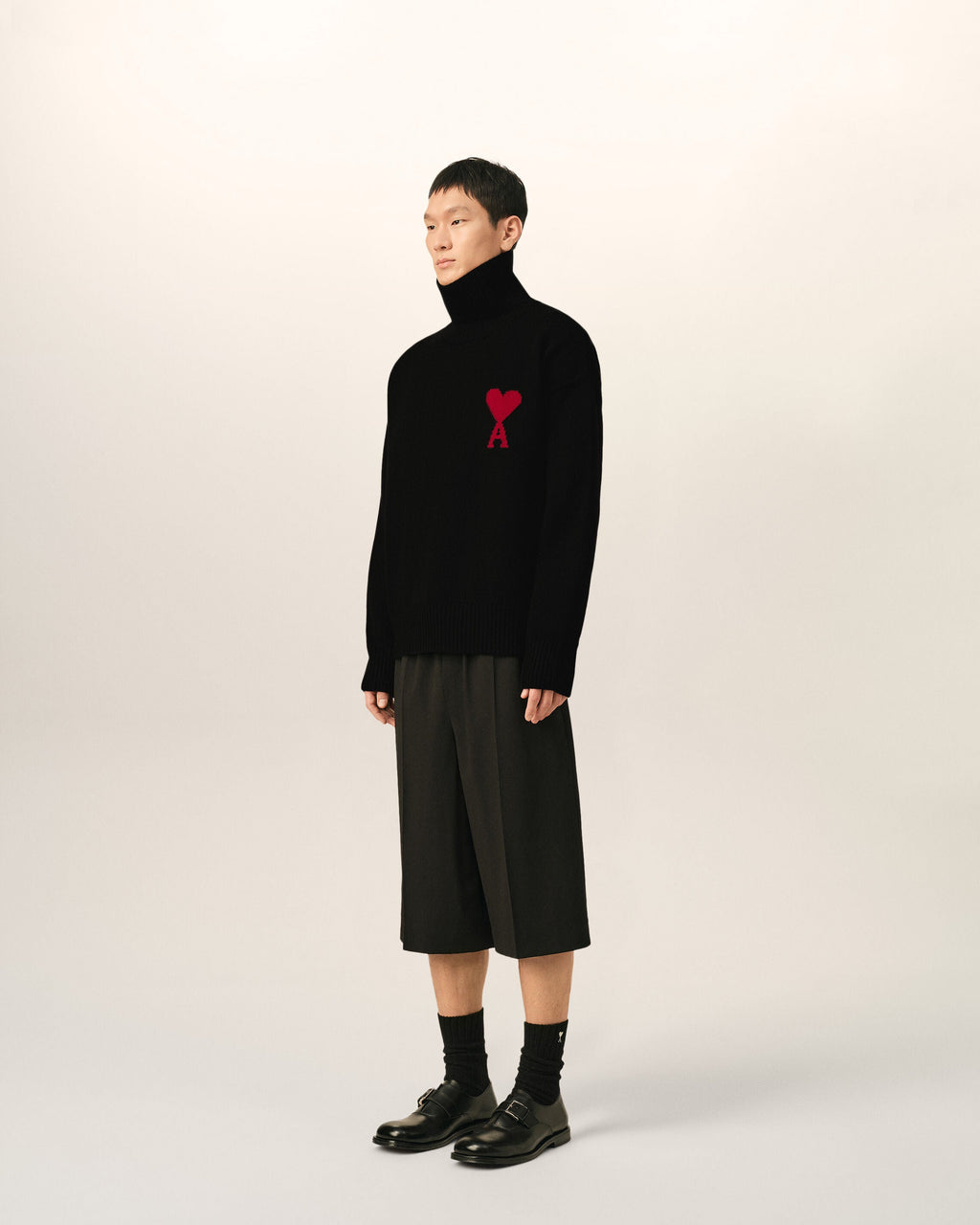 AMI Paris Ami de Cœur Large Logo Funnel Neck Sweater — Black / Red — styled side view