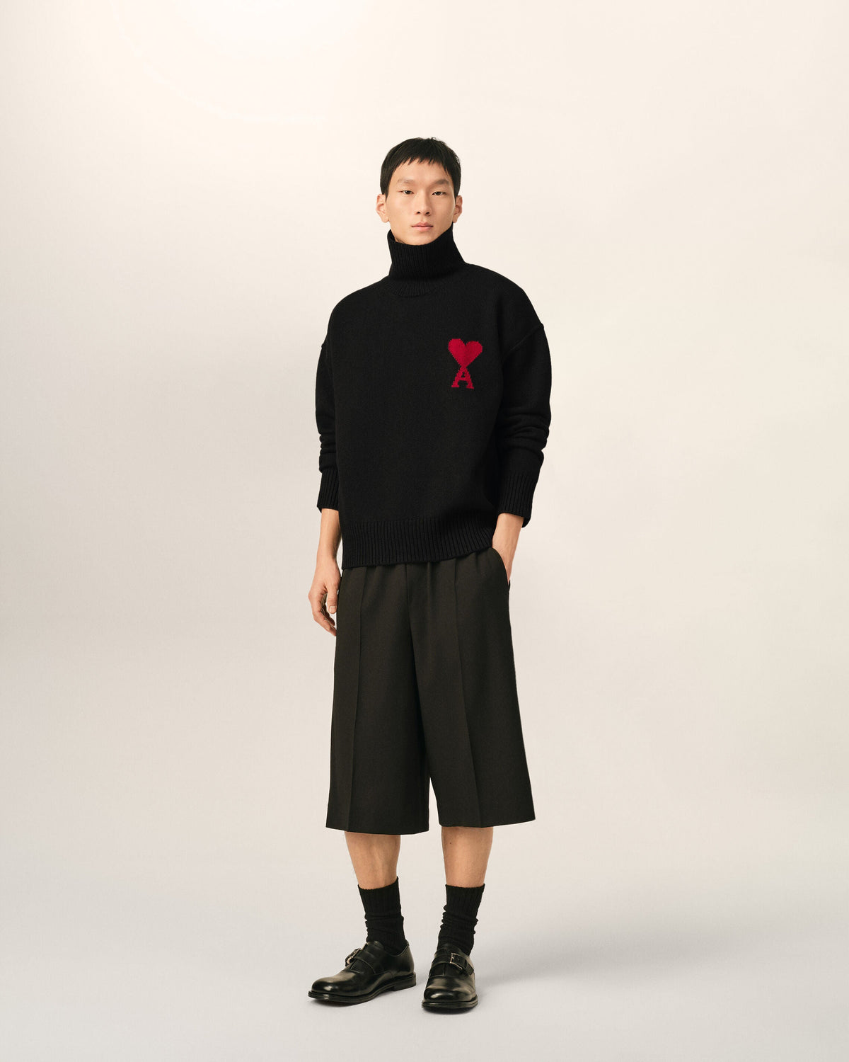 AMI Paris Ami de Cœur Large Logo Funnel Neck Sweater — Black / Red — styled front view